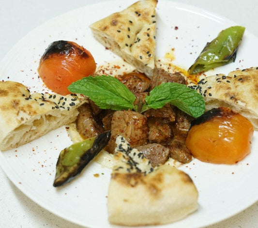 Alinazik Lamb with tender grilled lamb over creamy roasted eggplant puree, served at Anatolia Turkish Restaurant Singapore