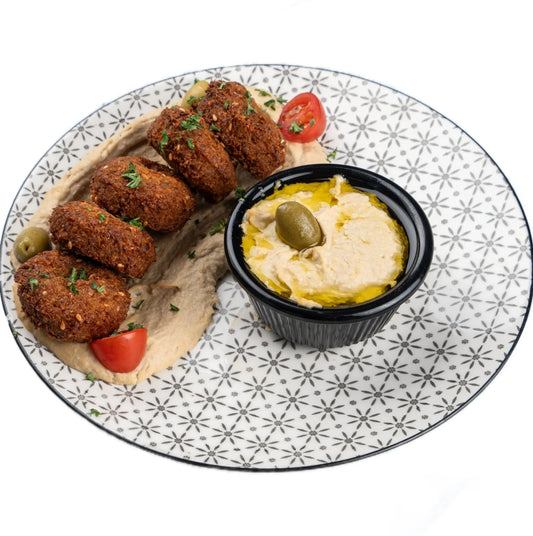 Crispy falafel served with hummus, fresh salad, and a side of tahini sauce at Anatolia Turkish Restaurant Singapore