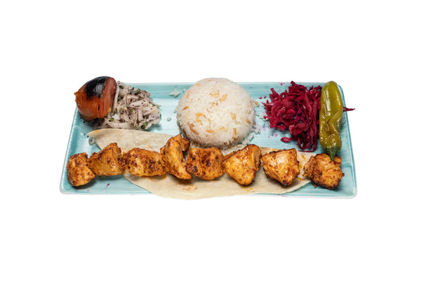 Chicken shish kebab served with rice and grilled vegetables at Anatolia Restaurant Singapore