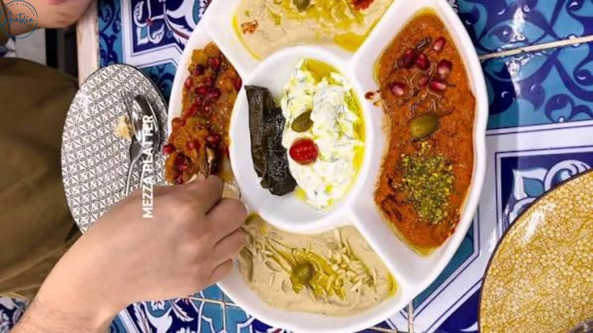 Mezze spread with hummus, dips and bread in the middle of the table at Anatolia, Arab Street