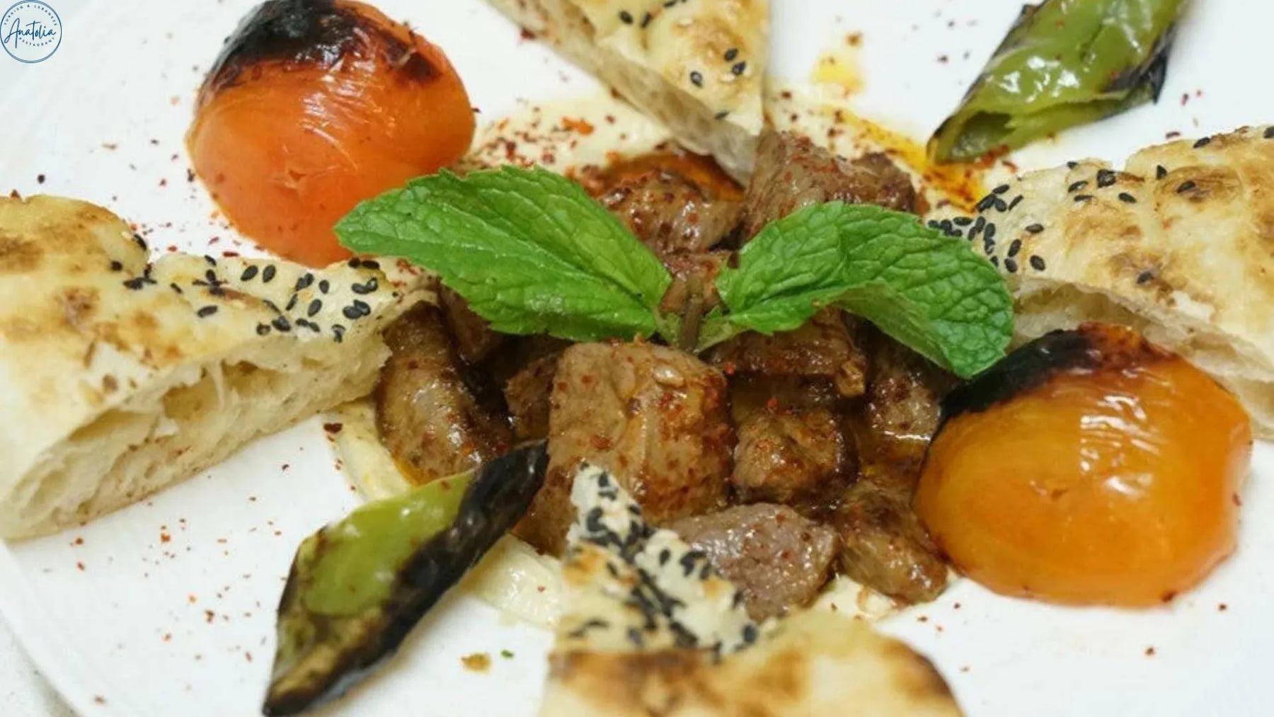 Ali nazik kebab with grilled lamb over smoky eggplant and yogurt puree at Anatolia Restaurant Singapore