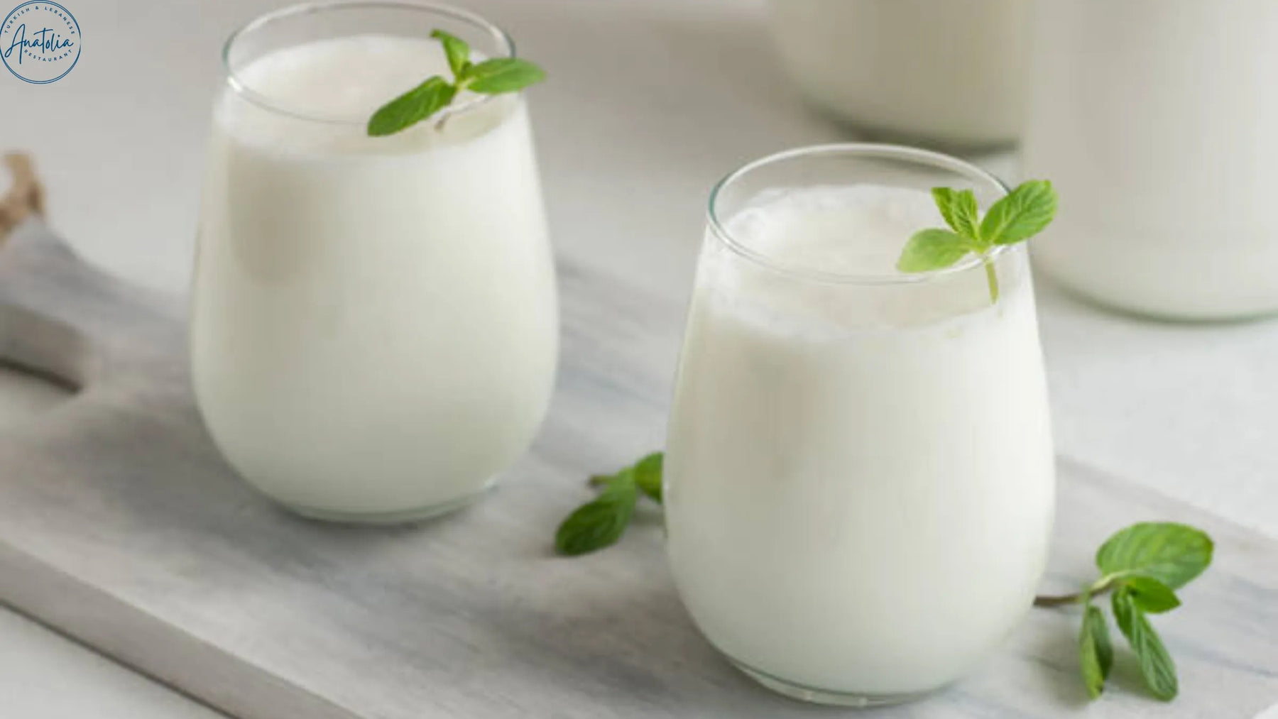 Glass of Turkish ayran with foam head at Anatolia Restaurant
