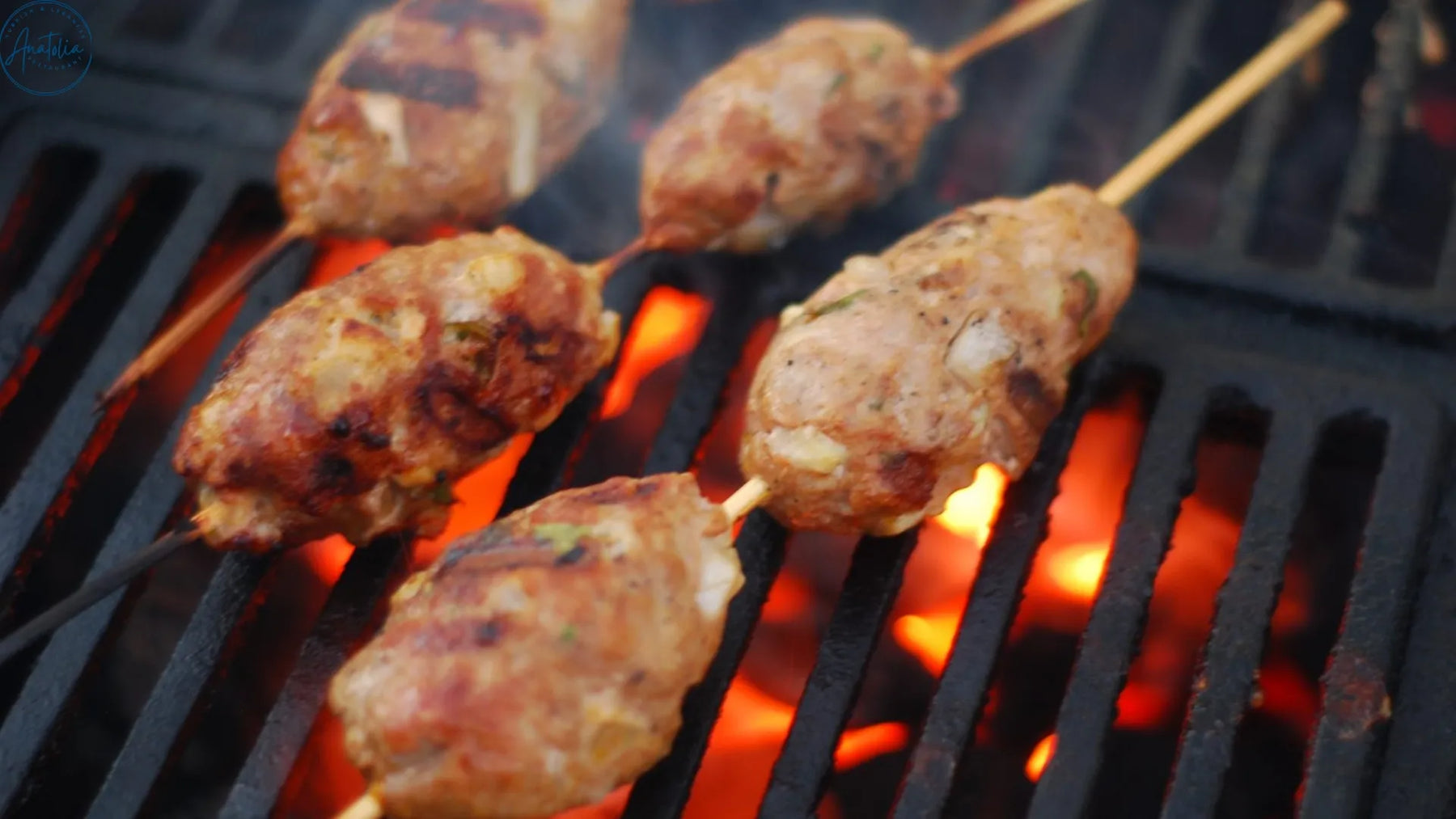 Turkish izgara kofte grilling over charcoal at Anatolia Restaurant