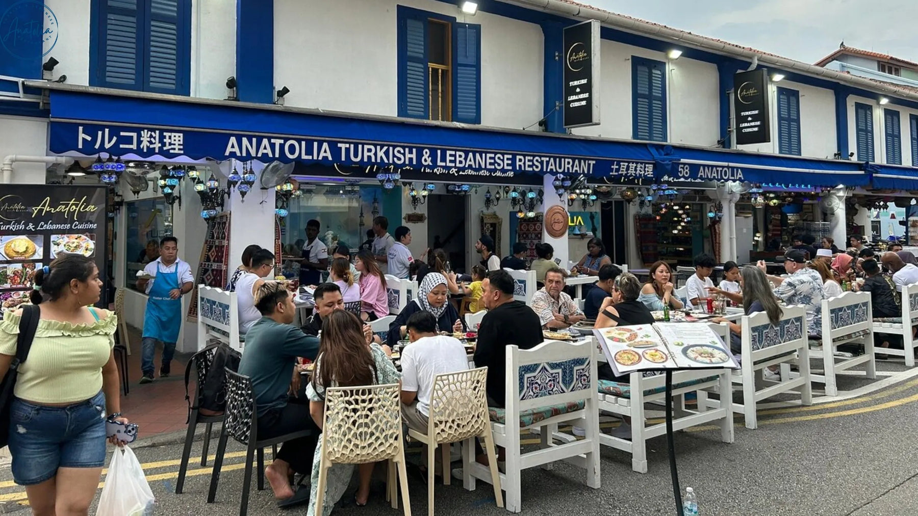 Mixed group sharing halal Turkish food at Anatolia Restaurant Arab Street