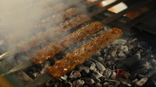 Authentic Turkish kebab grilling on hot charcoal with fresh lavash bread in Singapore.