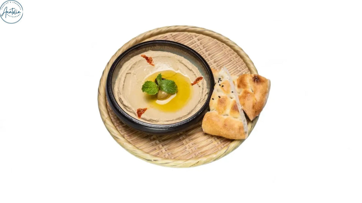 Turkish red lentil soup served with bread and a lemon wedge