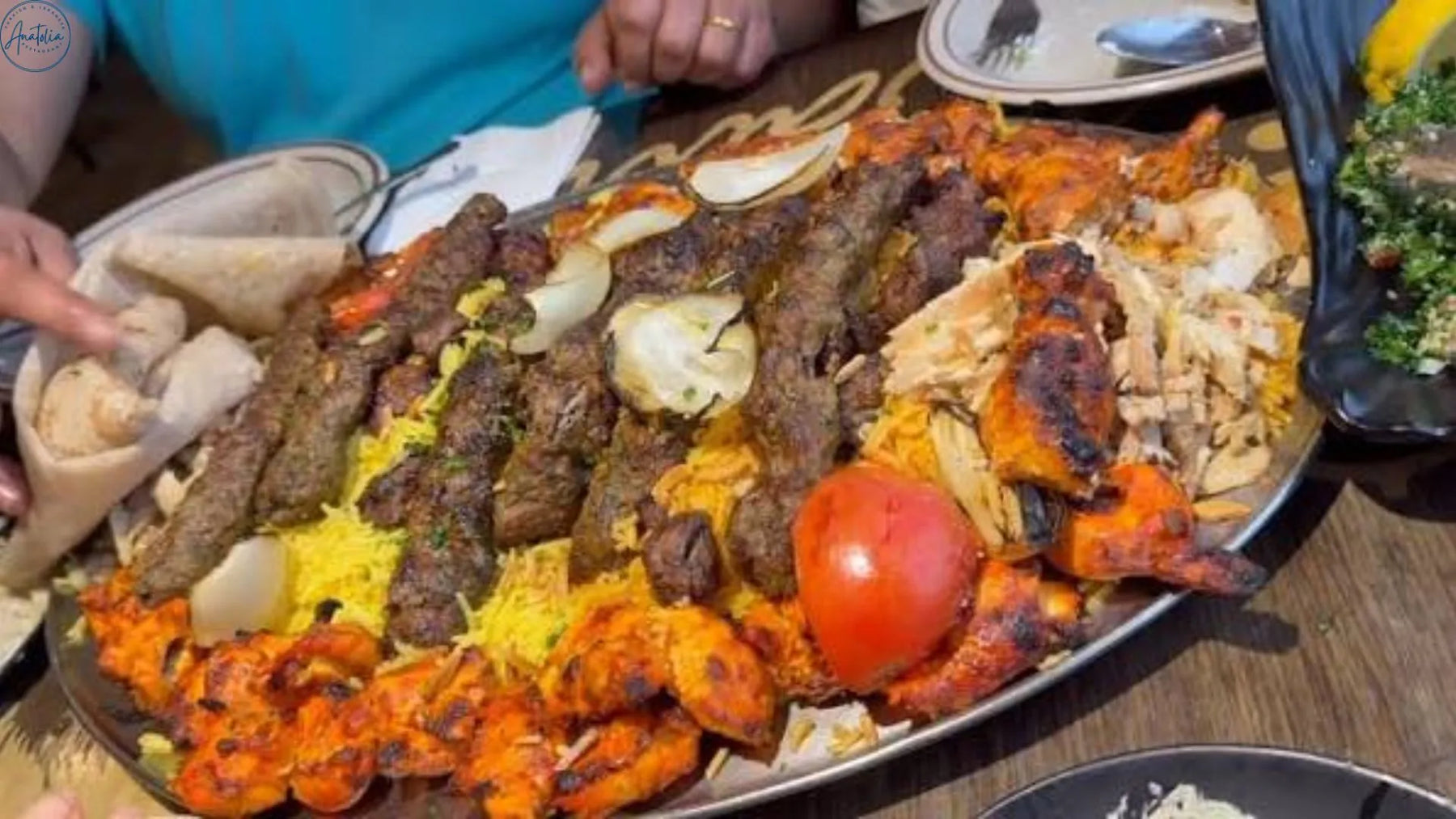 Traditional iskender kebab with doner meat, pide bread, tomato sauce and yogurt at Anatolia Restaurant Singapore
