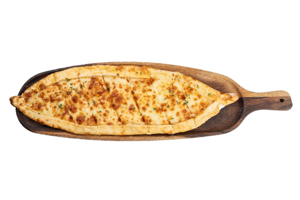 Cheese pide served on a wooden board at Anatolia Restaurant Singapore
