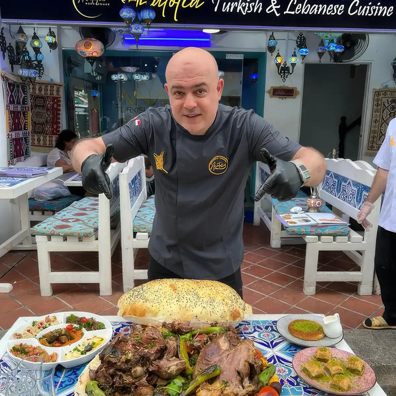 Chef presenting a signature dish at Anatolia, a halal Turkish restaurant in Singapore