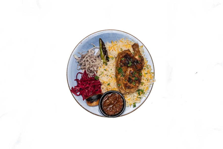 Traditional chicken mandi plate with rice at Anatolia Restaurant Singapore