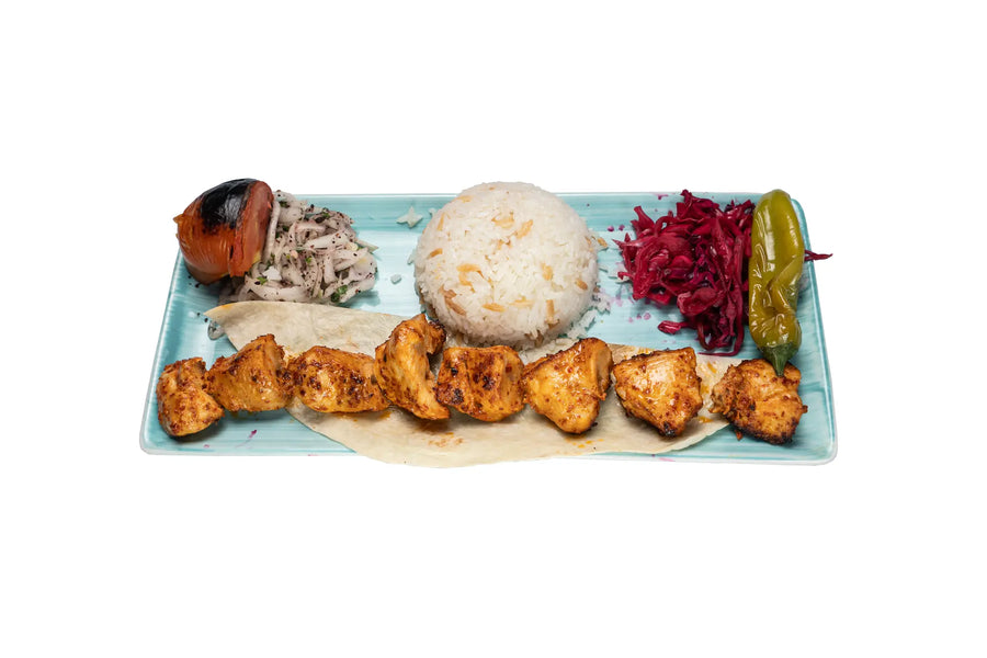 Chicken shish kebab served with rice and grilled vegetables at Anatolia Restaurant Singapore