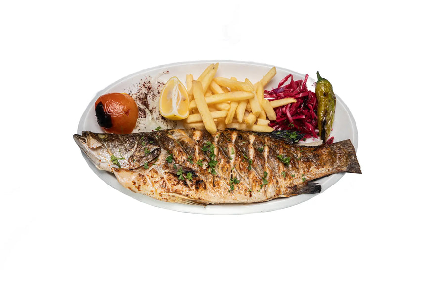 Grilled sea bass served with fries and vegetables at Anatolia Restaurant Singapore