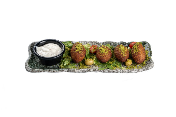 Kibbeh served with yoghurt dip and fresh greens at Anatolia Restaurant Singapore