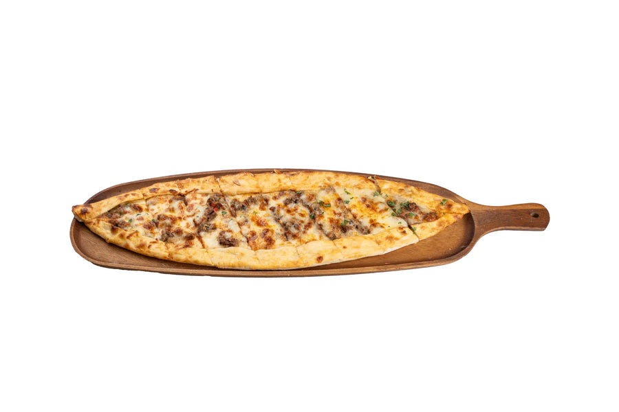 Lamb pide served on a wooden board at Anatolia Restaurant Singapore