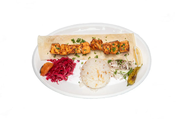 Salmon shish kebab served with rice and Turkish sides at Anatolia Restaurant Singapore