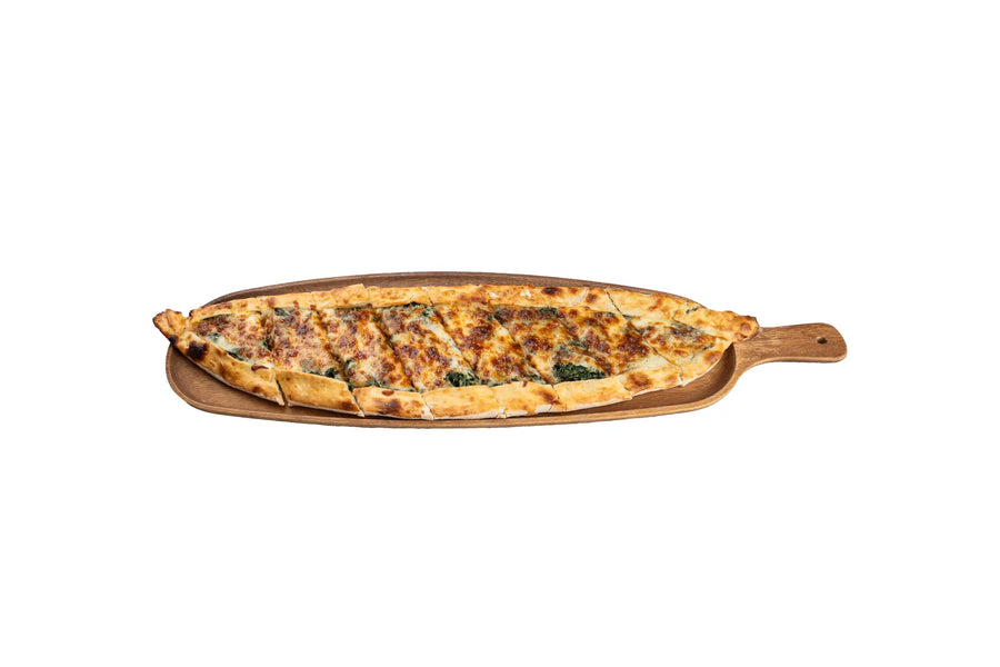 Spinach pide with melted cheese on wooden board at Anatolia Restaurant Singapore