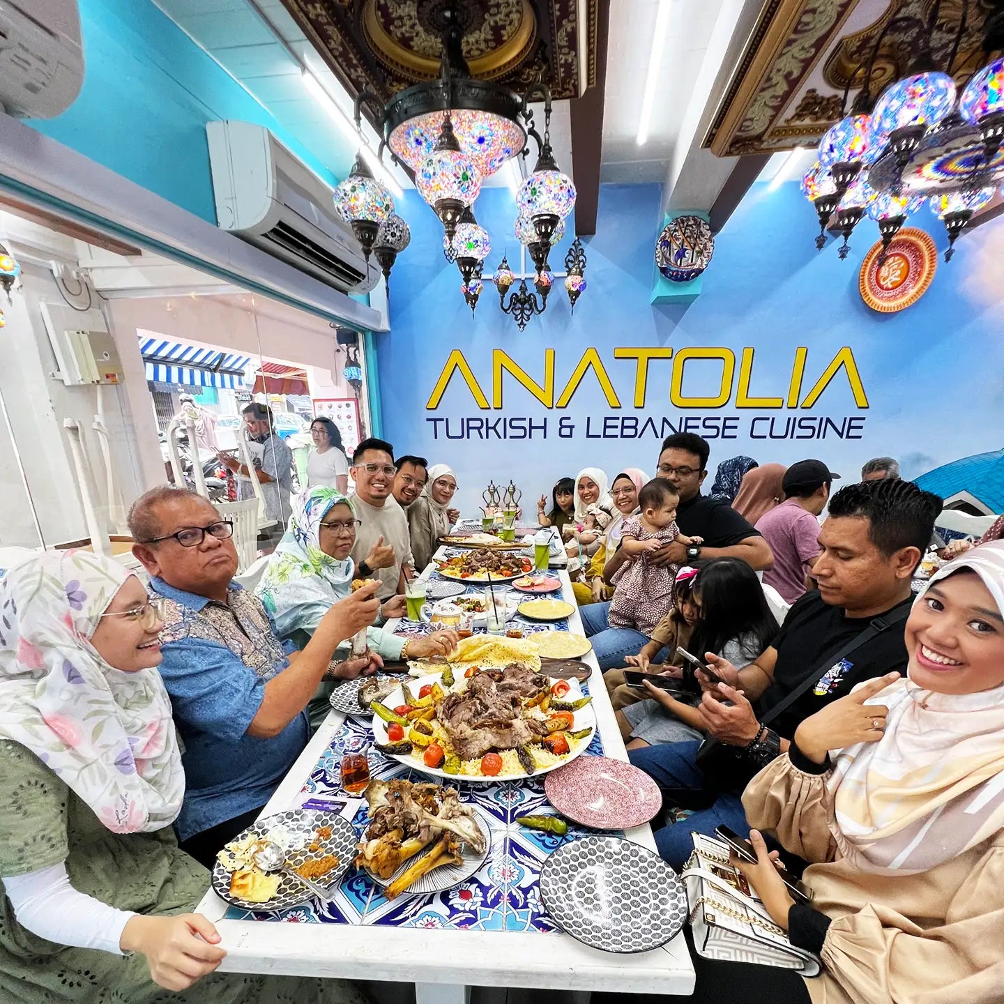 Families enjoying a halal dining experience at Anatolia Restaurant in Singapore