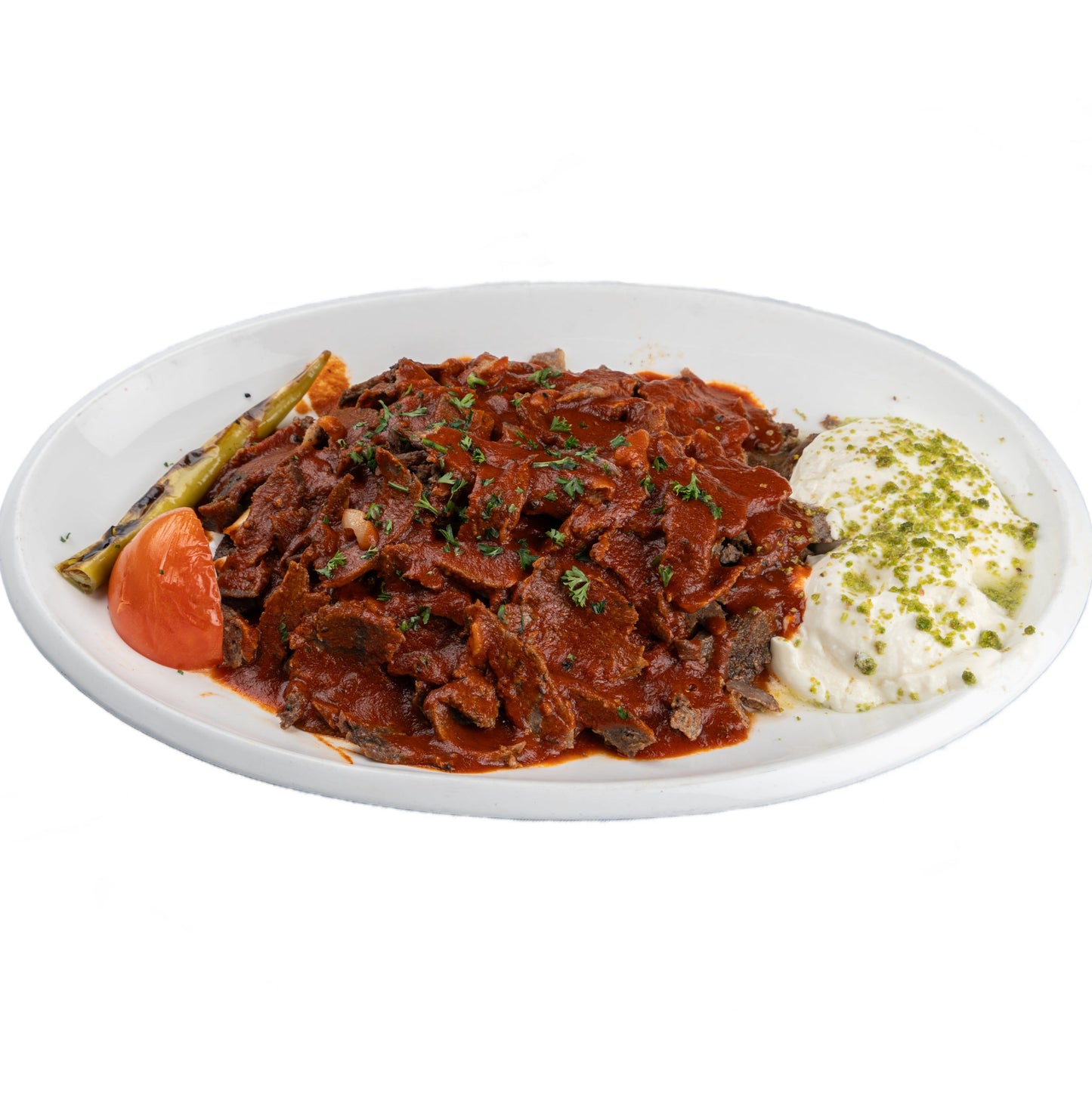 Lamb Iskender Kebab with tender grilled lamb over pita bread, topped with yogurt and tomato sauce, served at Anatolia Turkish Restaurant Singapore