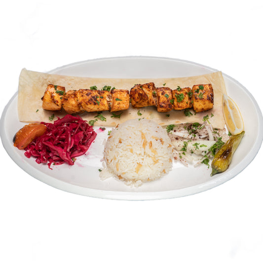 Grilled Salmon Shish Kebab skewers served with rice, fresh salad, and lemon at Anatolia Turkish Restaurant Singapore